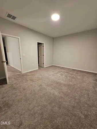 an empty room with a empty space and window