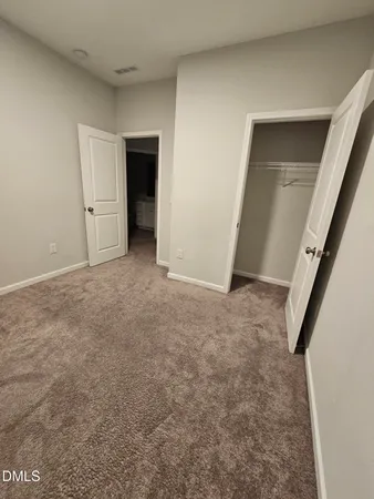 a bathroom with a shower a toilet and sink