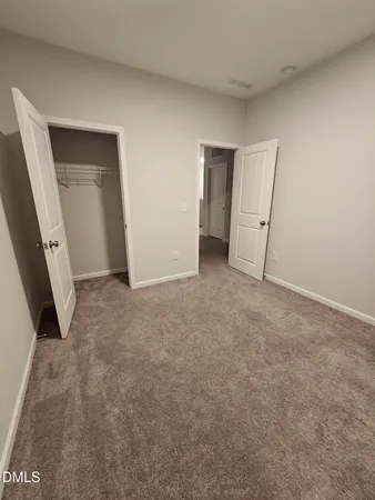 a bathroom with a granite countertop sink mirror and cabinets