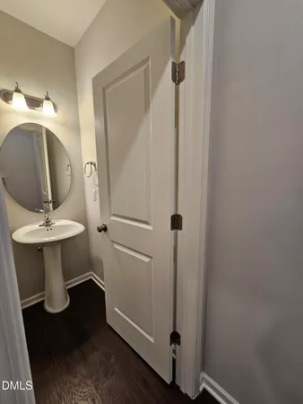 a bathroom with a sink and mirror