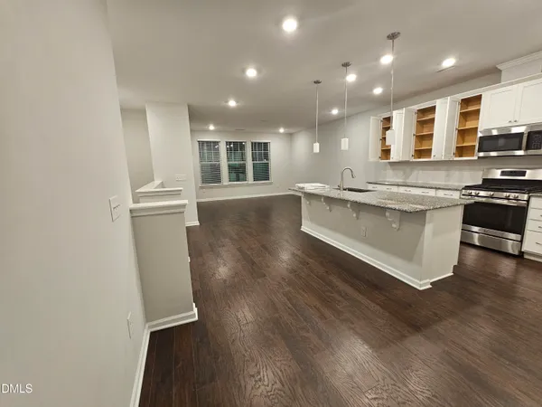a view of kitchen with sink microwave and stove