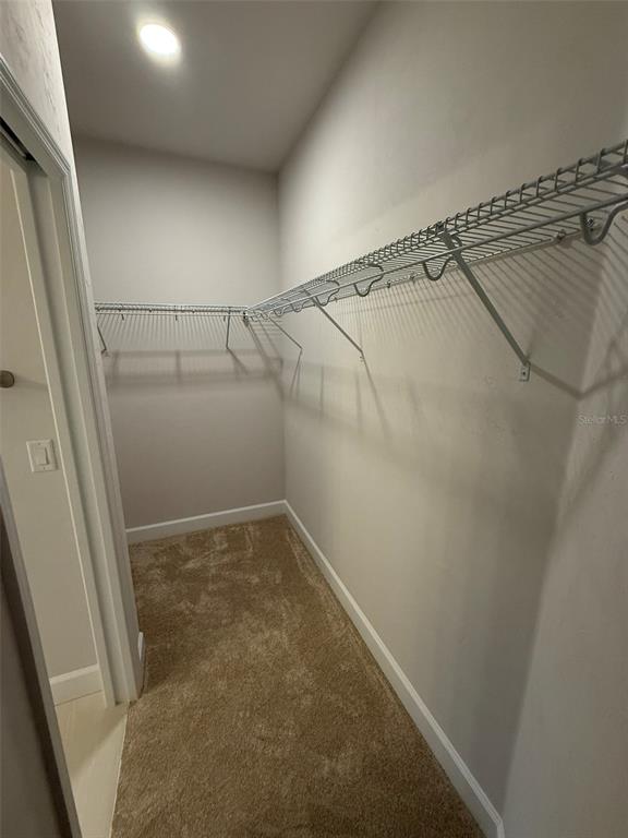 9654 Southwest 67th Lane Gainesville, FL 32608 - Photo 11 of 44 a view of a room with racks on the wall