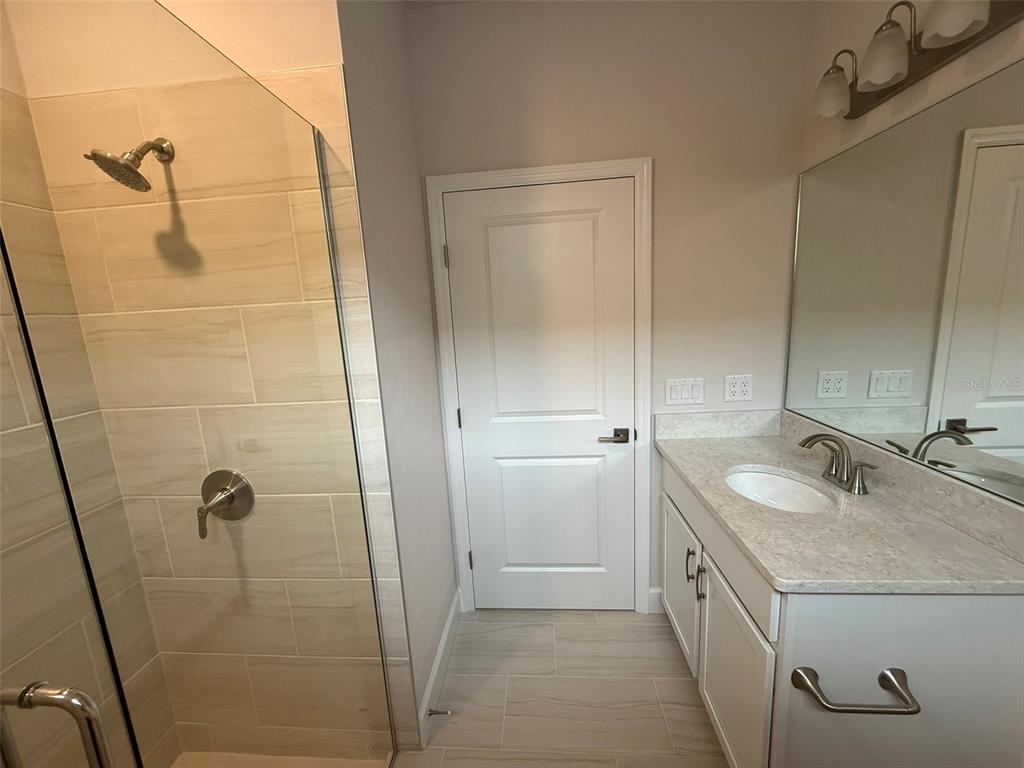 9654 Southwest 67th Lane Gainesville, FL 32608 - Photo 14 of 44 a bathroom with 2 sink and shower