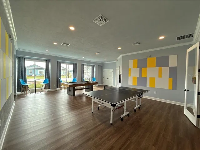 a room with wooden floor and glass door