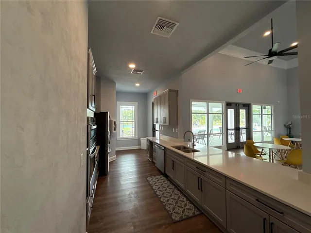 a lobby with furniture and floor to ceiling window