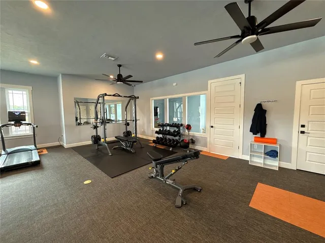 a view of a livingroom with workspace and a window