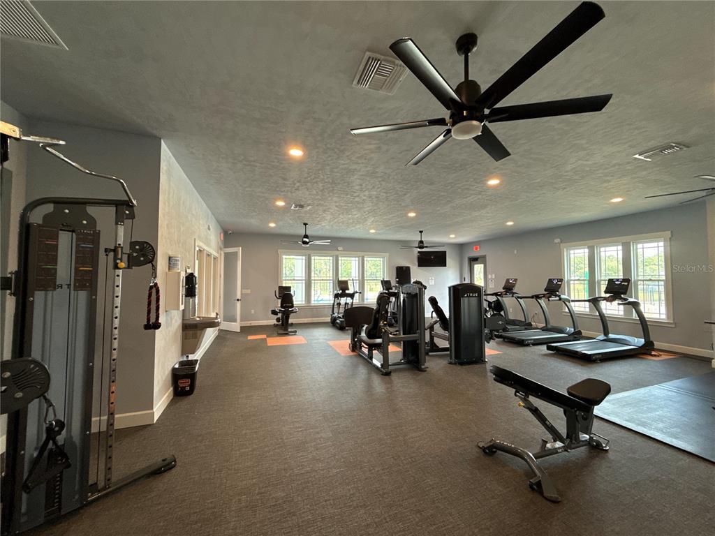 9654 Southwest 67th Lane Gainesville, FL 32608 - Photo 32 of 44 a view of a room with gym equipment