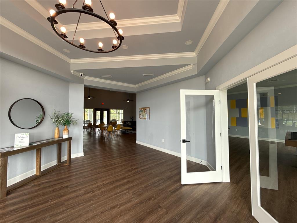 9654 Southwest 67th Lane Gainesville, FL 32608 - Photo 37 of 44 a view of a room with wooden floor and window