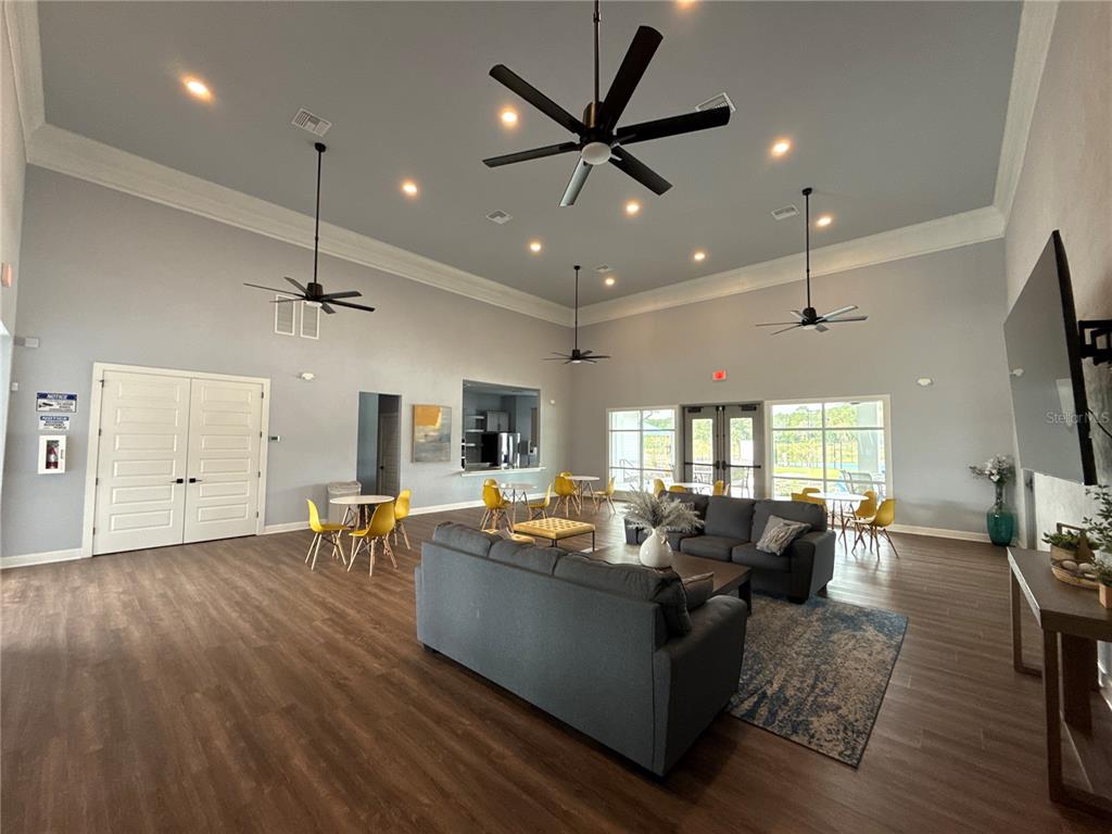 9654 Southwest 67th Lane Gainesville, FL 32608 - Photo 38 of 44 a living room with furniture kitchen view and a large window
