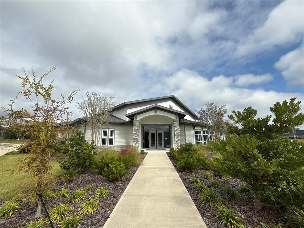 9654 Southwest 67th Lane Gainesville, FL 32608 - Photo 39 of 44 a front view of a house with a yard