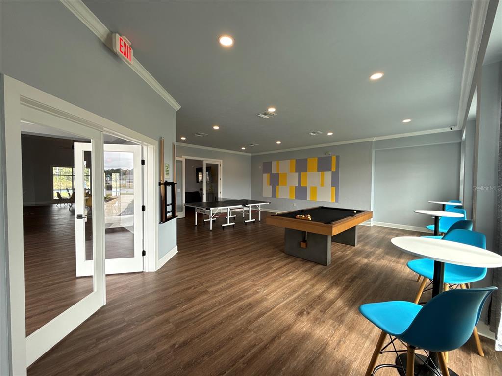 9654 Southwest 67th Lane Gainesville, FL 32608 - Photo 41 of 44 a living room with furniture and a wooden floor