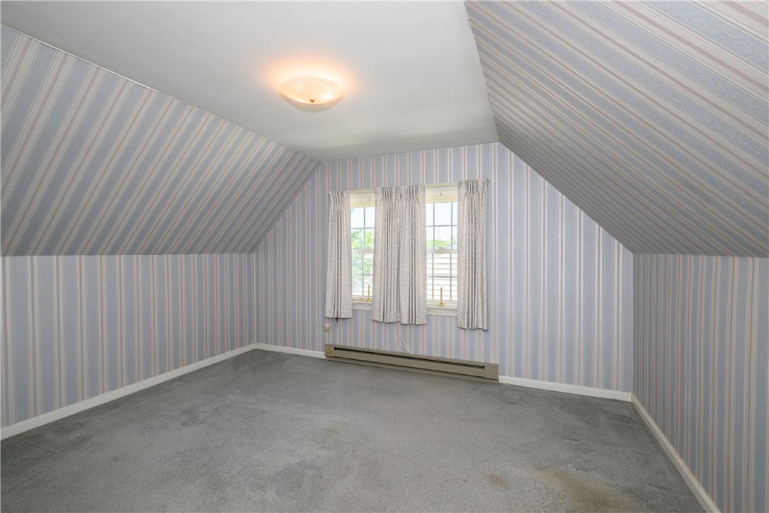 2270 Rodgers Street Bethlehem, PA 18017 - Photo 17 of 24 Bright attic space features sloped walls, a cozy carpet, and multiple windows.