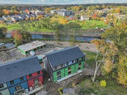 an aerial view of residential houses with outdoor space