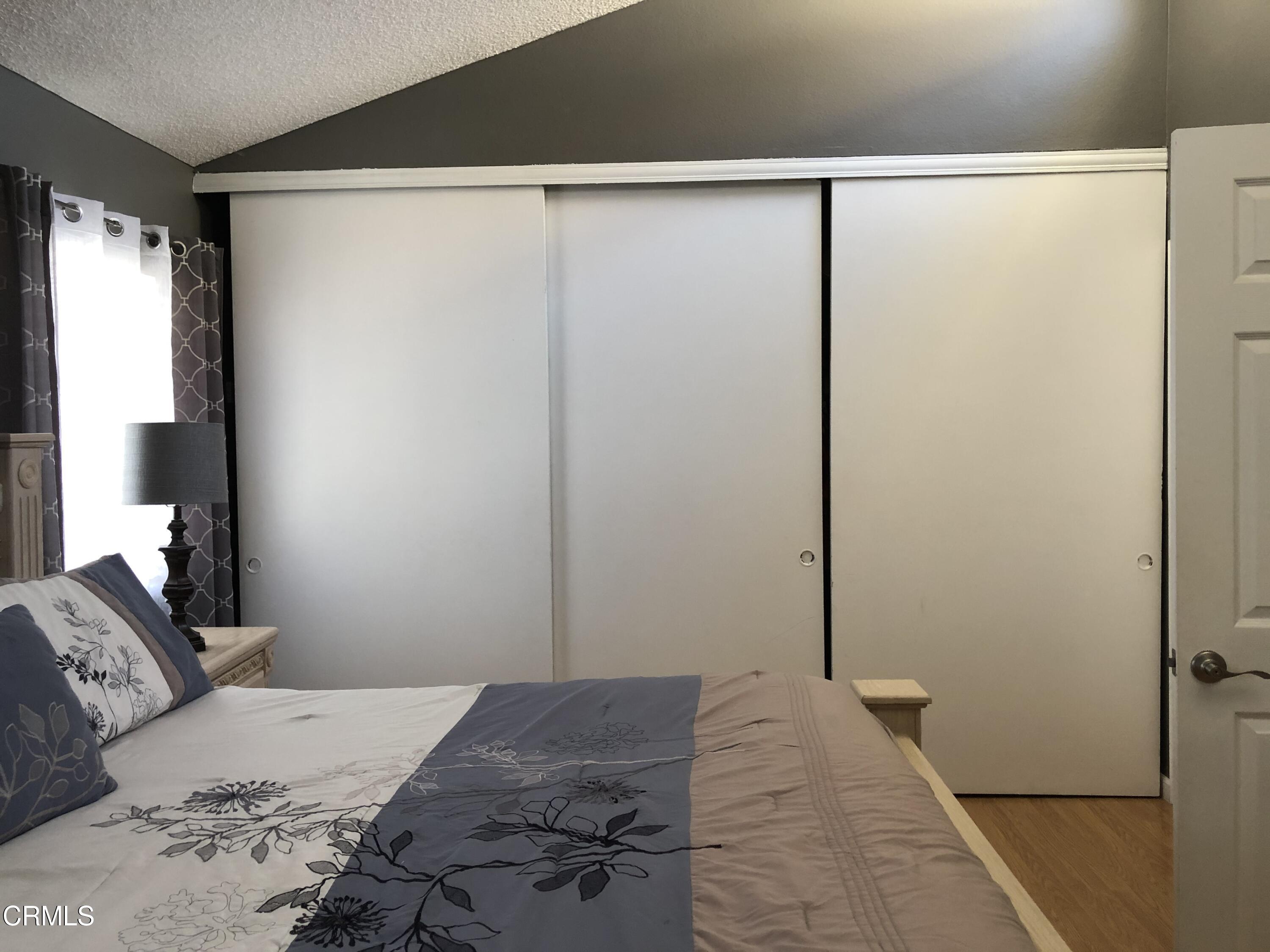 352 East Bard Road Oxnard, CA 93033 - Photo 17 of 26 a bedroom with a bed and a window