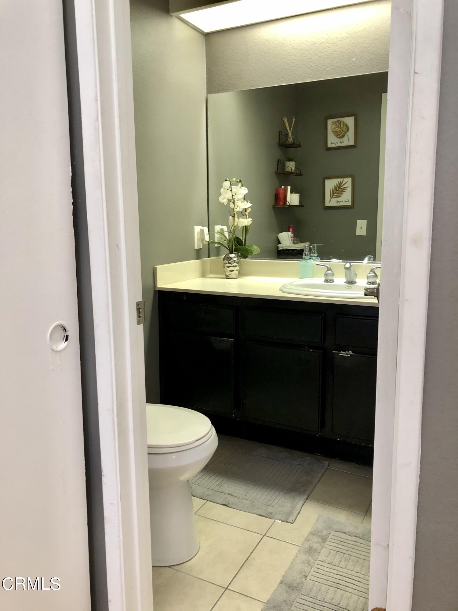 352 East Bard Road Oxnard, CA 93033 - Photo 19 of 26 a bathroom with a sink and a toilet