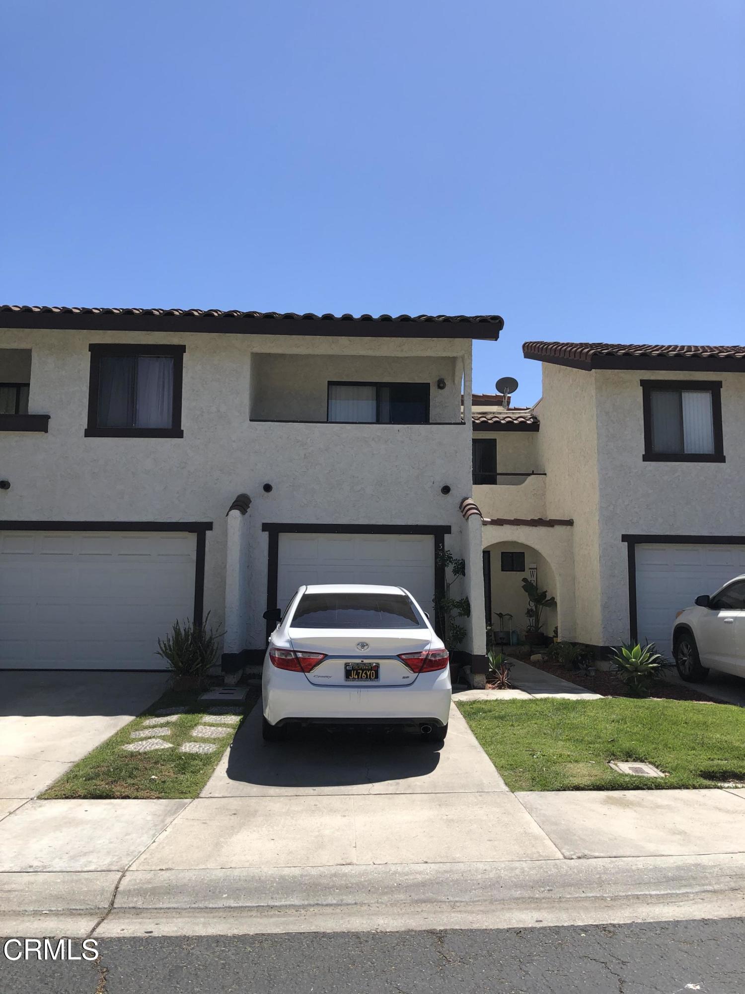 352 East Bard Road Oxnard, CA 93033 - Photo 3 of 26 a car parked in front of a house