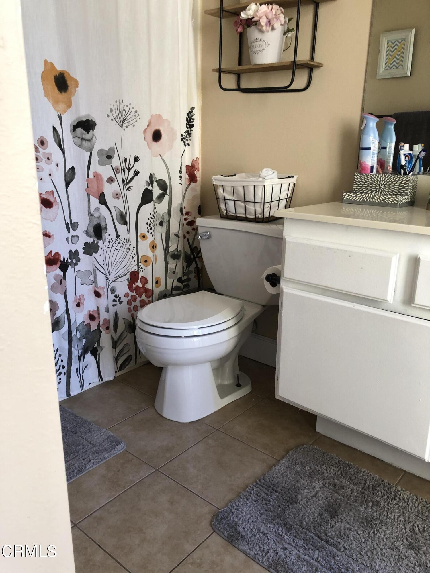 352 East Bard Road Oxnard, CA 93033 - Photo 21 of 26 a bathroom with a toilet and a sink