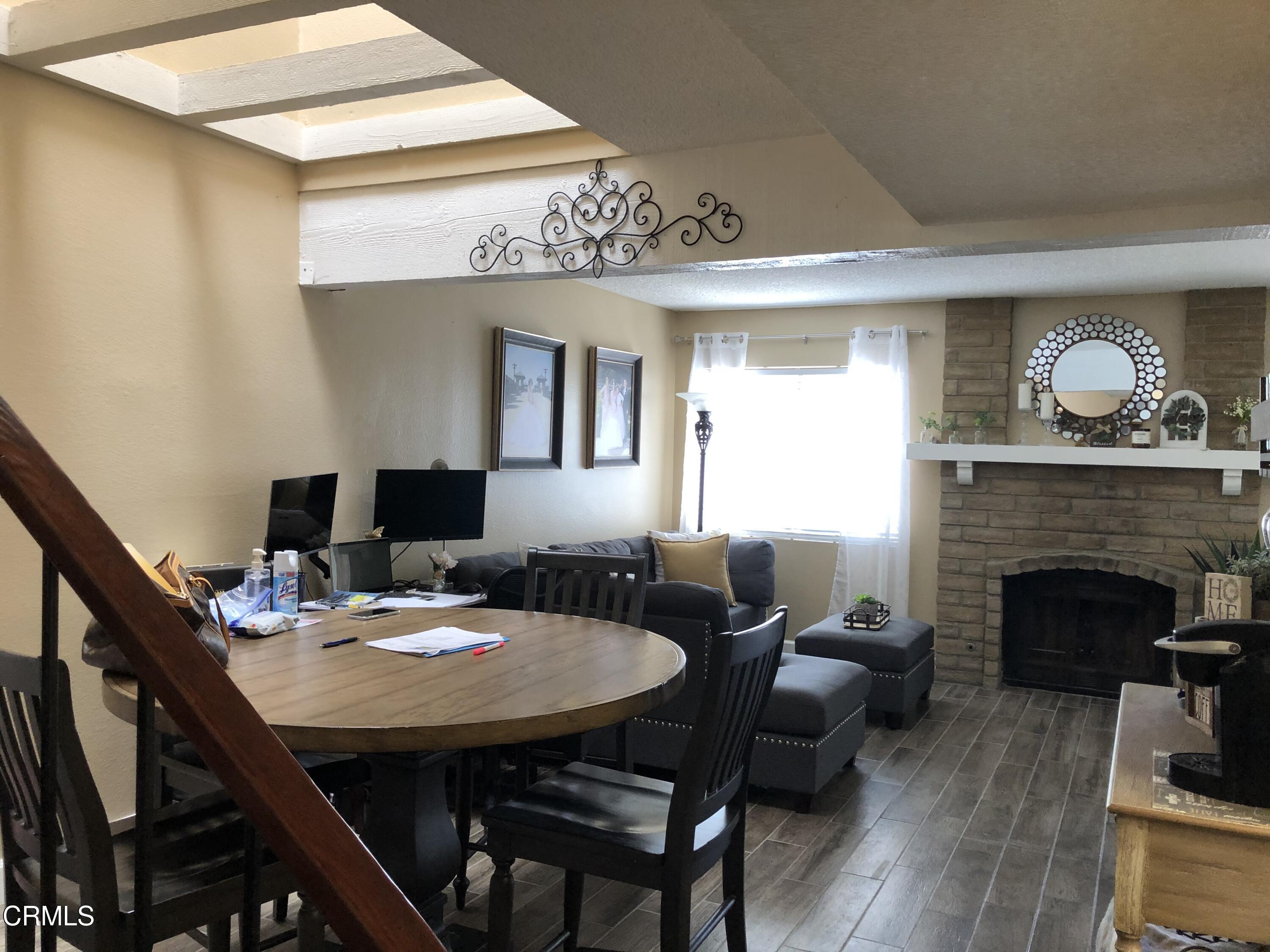 352 East Bard Road Oxnard, CA 93033 - Photo 5 of 26 a view of a livingroom with furniture and a fireplace