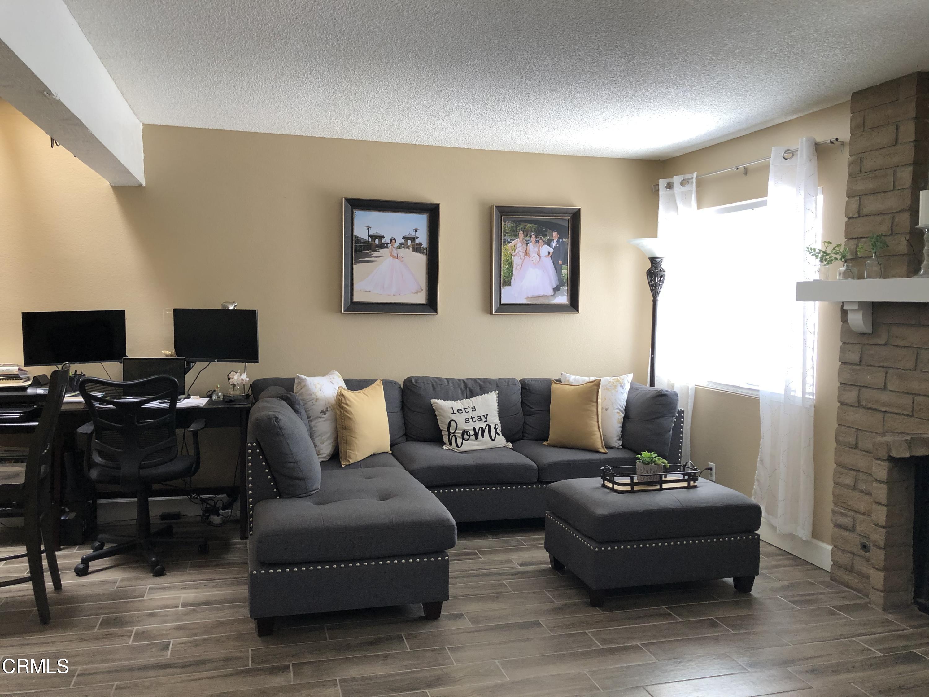 352 East Bard Road Oxnard, CA 93033 - Photo 6 of 26 a living room with furniture and a flat screen tv