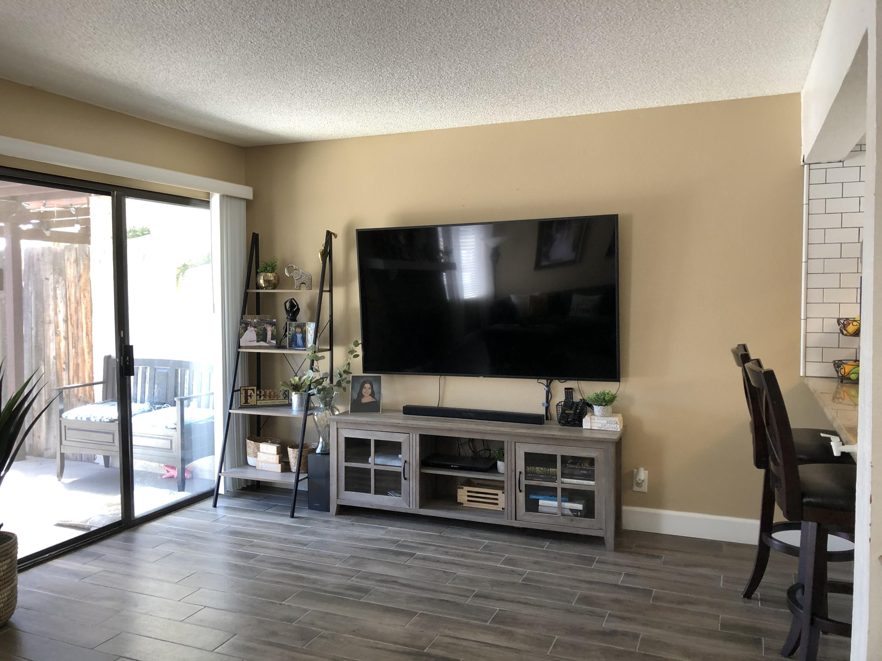 352 East Bard Road Oxnard, CA 93033 - Photo 7 of 26 a living room with furniture and a flat screen tv