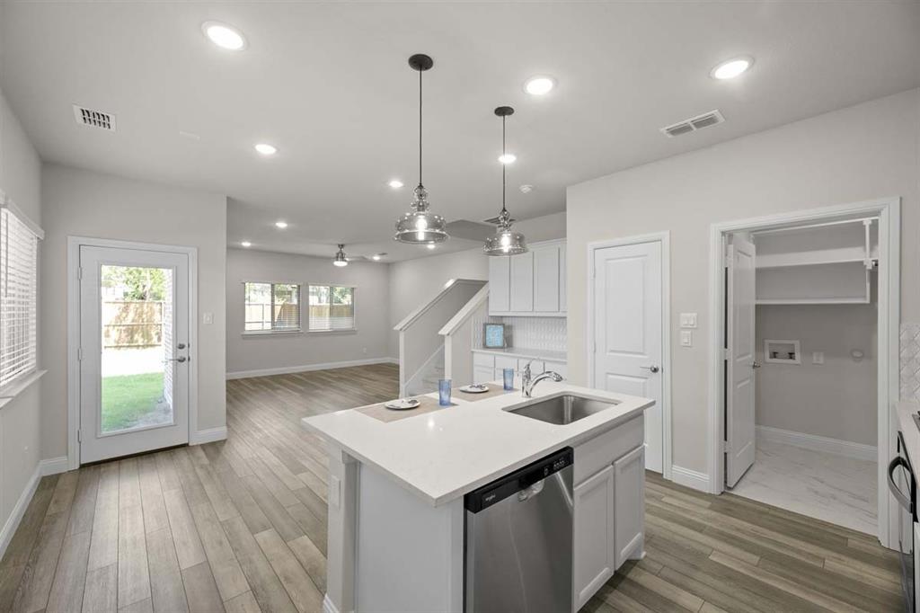 203 Griffith Drive Princeton, TX 75407 - Photo 1 of 15 a kitchen with a sink and natural light