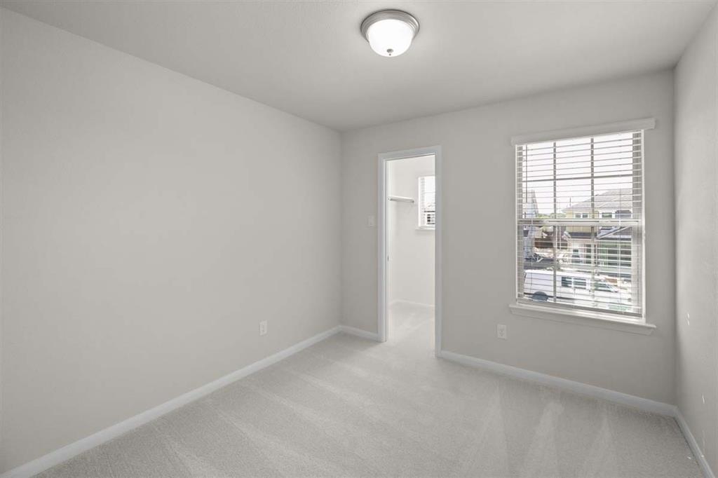 203 Griffith Drive Princeton, TX 75407 - Photo 12 of 15 an empty room with a window