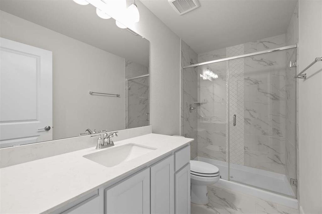 203 Griffith Drive Princeton, TX 75407 - Photo 8 of 15 a bathroom with a sink a toilet and shower