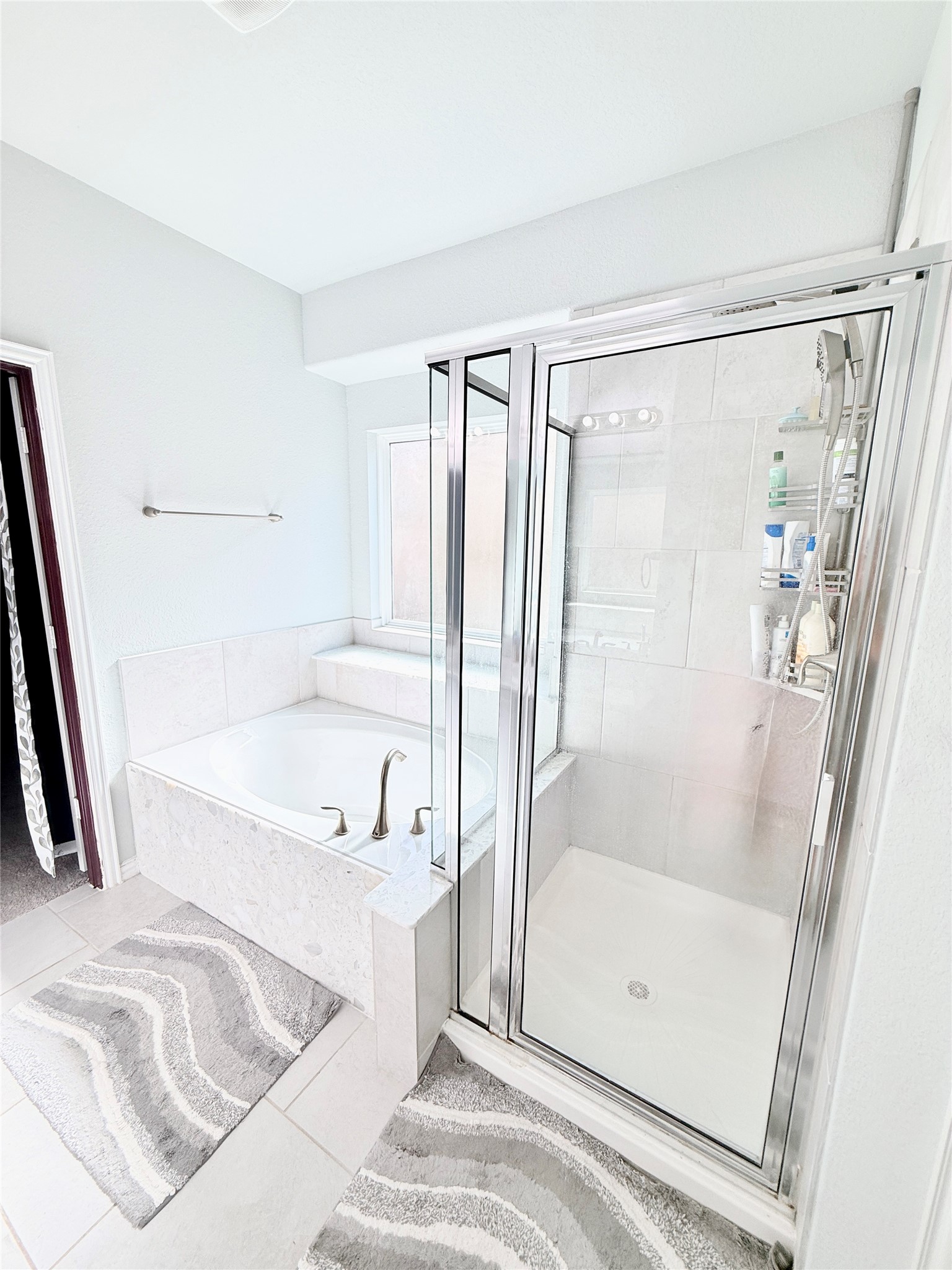 104 Kelly Street Angleton, TX 77515 - Photo 10 of 20 a bathroom with a tub shower and a sink