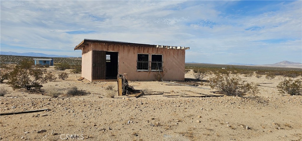 1234 Brant Cross Road Twentynine Palms, CA 92277 - Photo 1 of 7 a view of a house with a snow