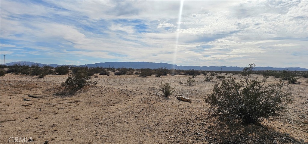 1234 Brant Cross Road Twentynine Palms, CA 92277 - Photo 3 of 7 a view of a lake with a building in the background