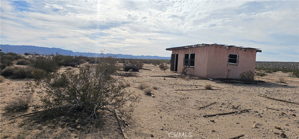 1234 Brant Cross Road Twentynine Palms, CA 92277 - Photo 6 of 7 a view of a house with wooden fence