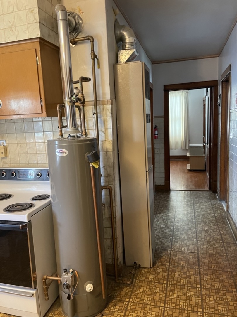 4555 South Francisco Avenue Chicago, IL 60632 - Photo 13 of 40 a view of a refrigerator in kitchen and a sink