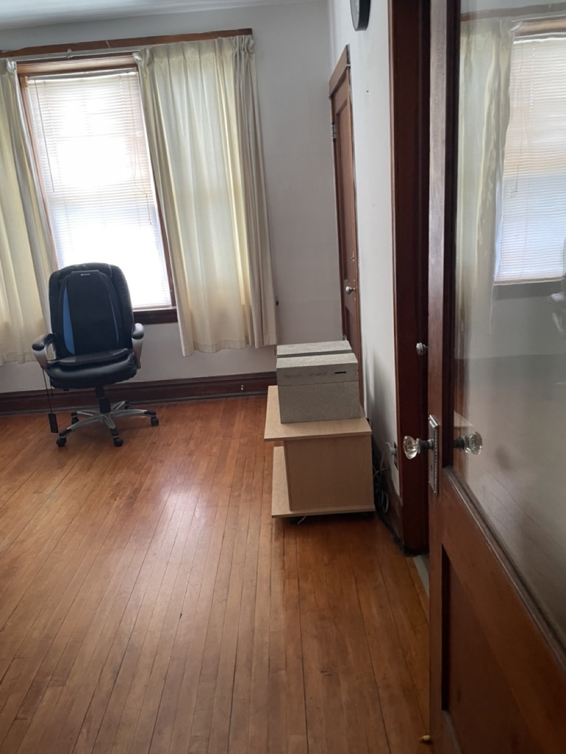 4555 South Francisco Avenue Chicago, IL 60632 - Photo 20 of 40 a view of room with window and wooden floor