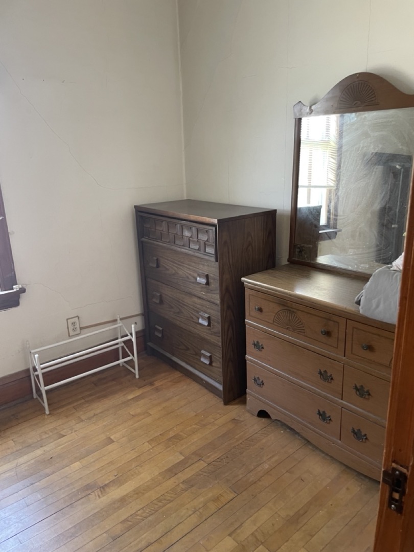 4555 South Francisco Avenue Chicago, IL 60632 - Photo 27 of 40 a view of a dresser with wooden floor