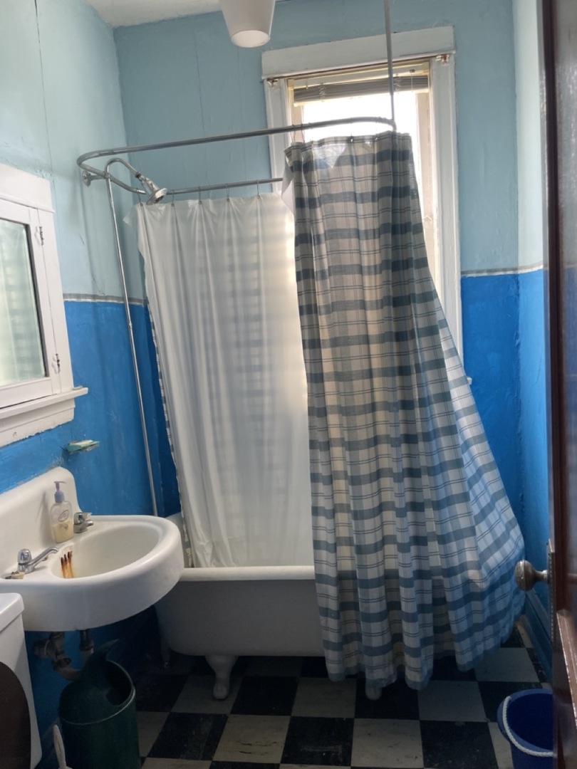 4555 South Francisco Avenue Chicago, IL 60632 - Photo 30 of 40 a bathroom with a sink and a shower