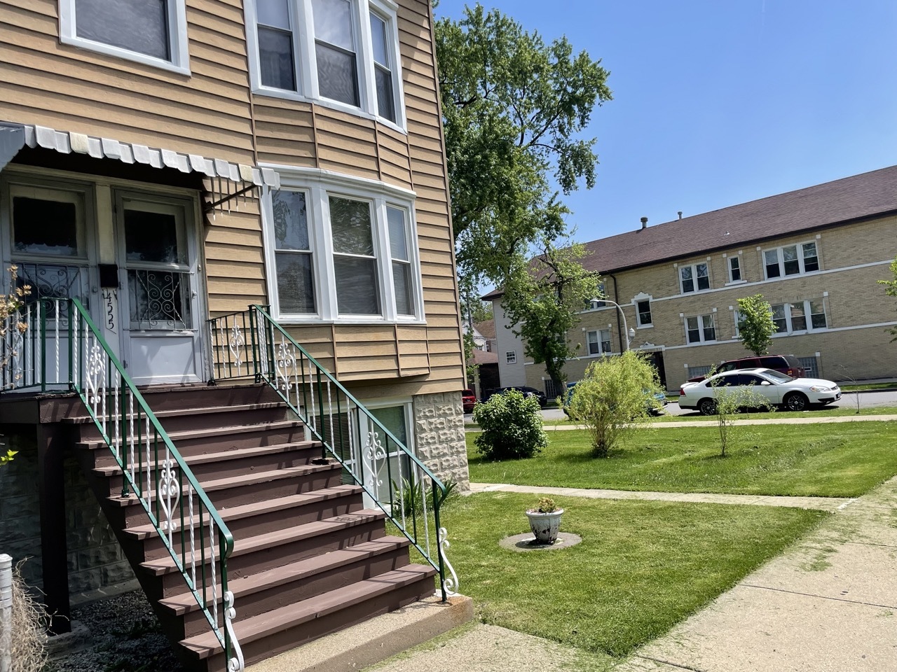 4555 South Francisco Avenue Chicago, IL 60632 - Photo 3 of 40 a front view of a house with garden and a car