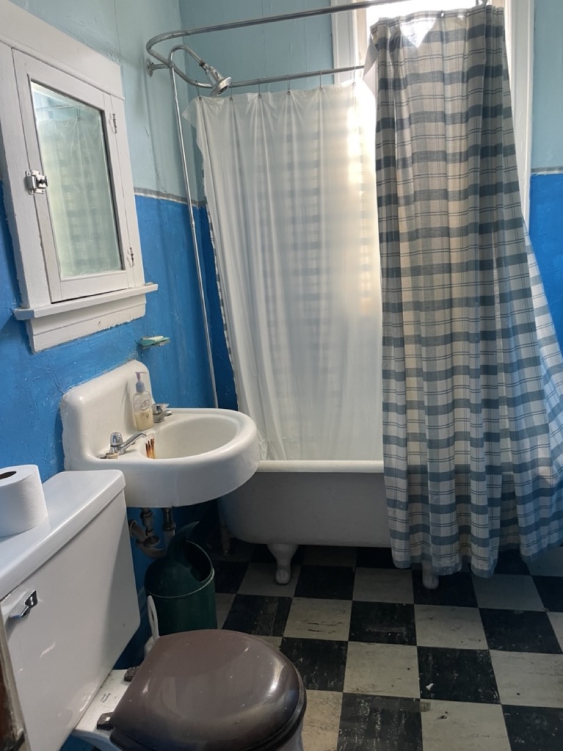 4555 South Francisco Avenue Chicago, IL 60632 - Photo 31 of 40 a bathroom with a sink and a mirror