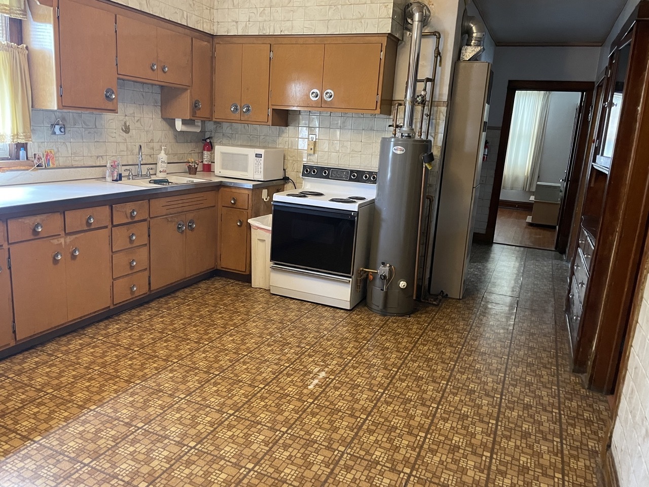 4555 South Francisco Avenue Chicago, IL 60632 - Photo 8 of 40 a kitchen with stainless steel appliances a stove a sink and a refrigerator