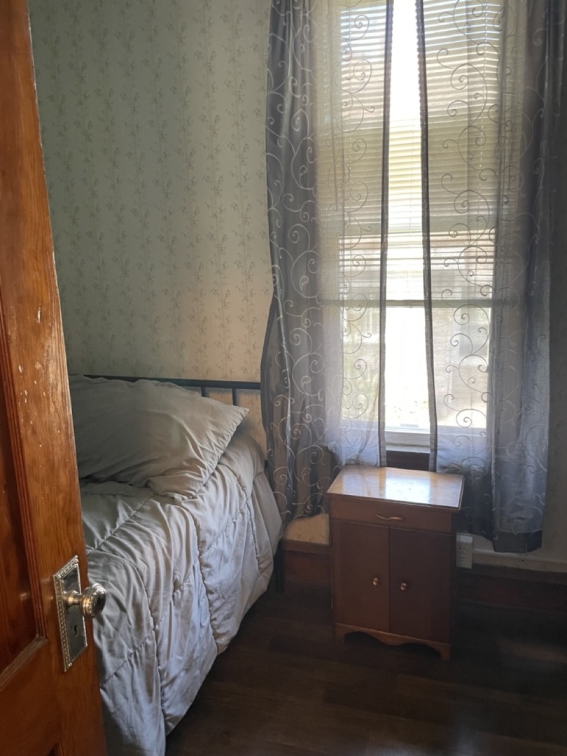 4555 South Francisco Avenue Chicago, IL 60632 - Photo 10 of 40 a bed sitting in a bedroom next to a window