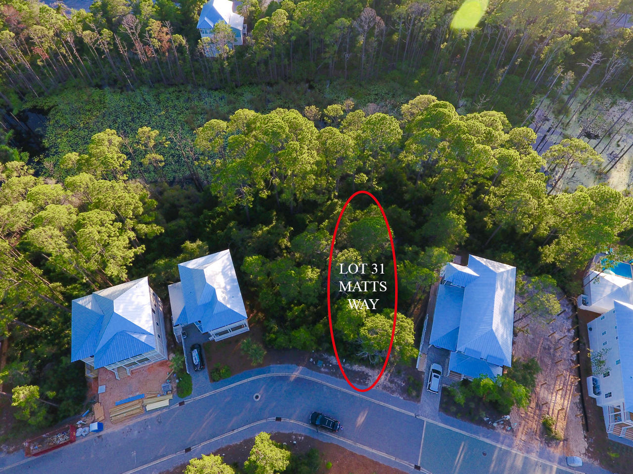 Lot 31 Matts Way Santa Rosa Beach, FL 32459 - Photo 5 of 9 an outdoor space with seating area and trees around