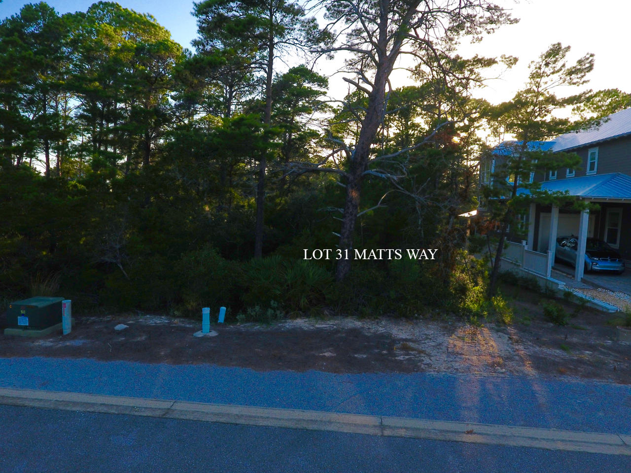 Lot 31 Matts Way Santa Rosa Beach, FL 32459 - Photo 8 of 9 a sign board with a bench and yard