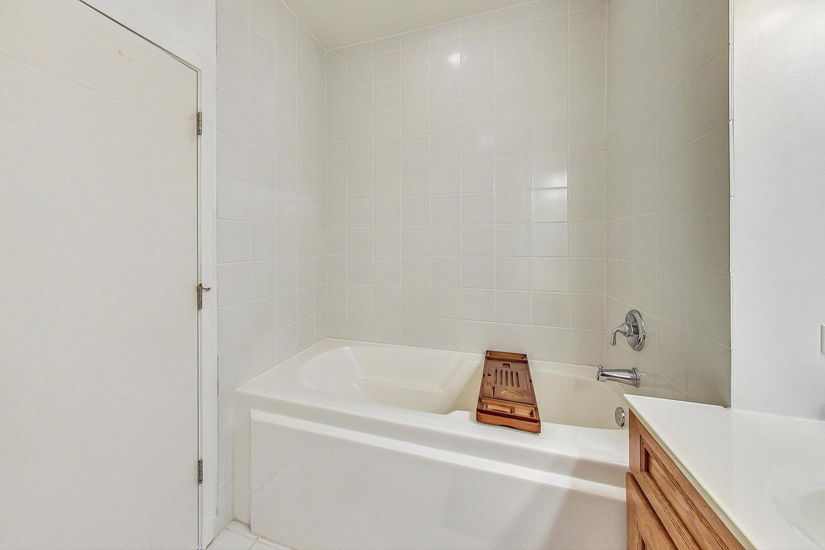 1111 West 14th Place, Unit 328 Chicago, IL 60608 - Photo 36 of 49 a bathroom with a bathtub