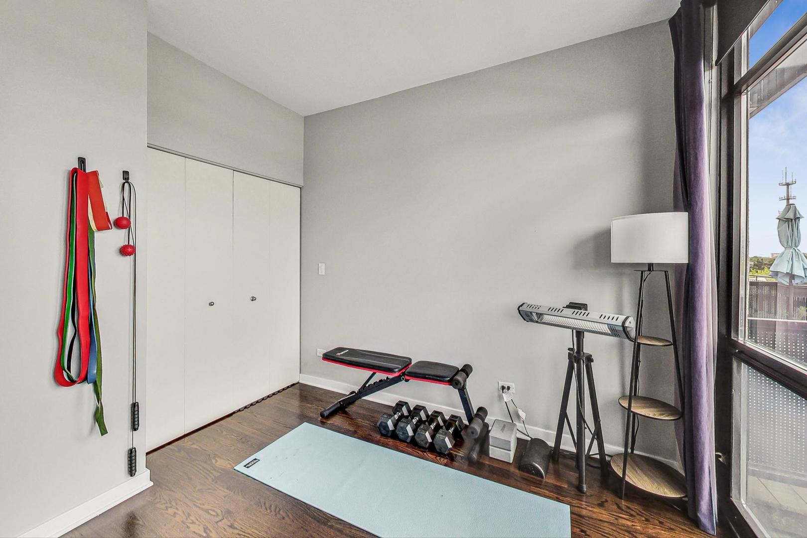 1111 West 14th Place, Unit 328 Chicago, IL 60608 - Photo 38 of 49 a view of a room with gym equipment