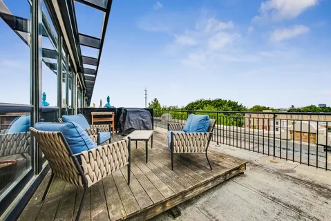 a view of balcony with furniture