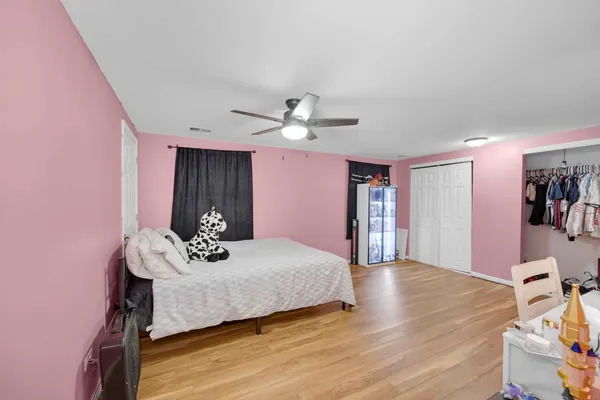 a bed room with a bed and a chandelier