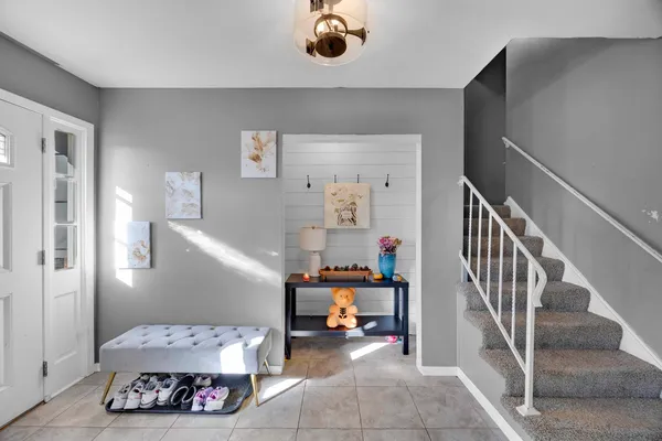 a bedroom with furniture and a book shelf
