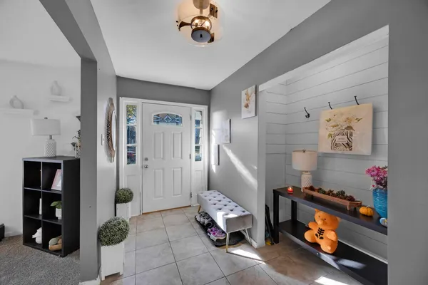 a room with toys and a chandelier
