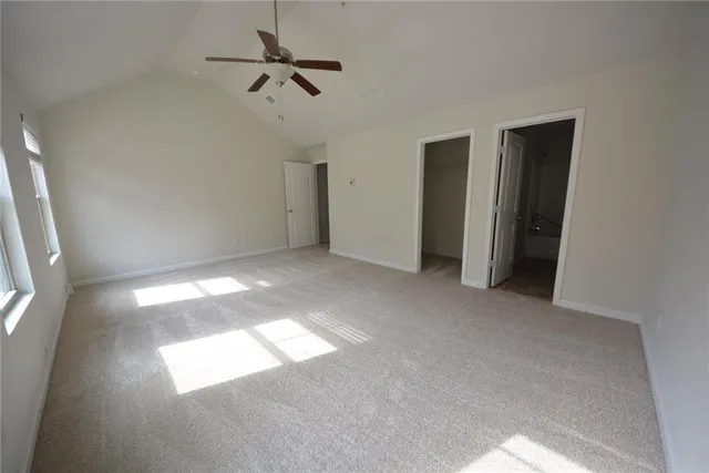 a view of empty room with windows