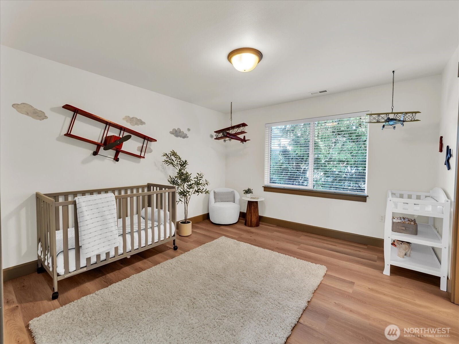 2115 201st Place Southeast, Unit K2 Bothell, WA 98012 - Photo 18 of 28 a living room with furniture and a window
