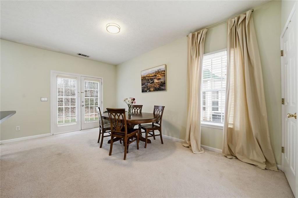 148 Timber Gate Drive Lawrenceville, GA 30045 - Photo 16 of 38 a dining room with furniture and window